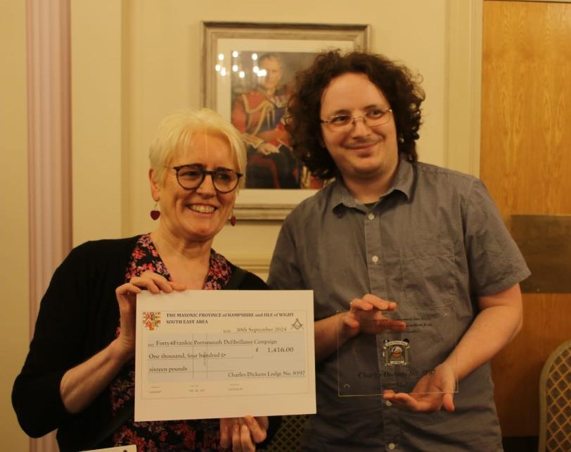 Steven Parnell presenting a cheque